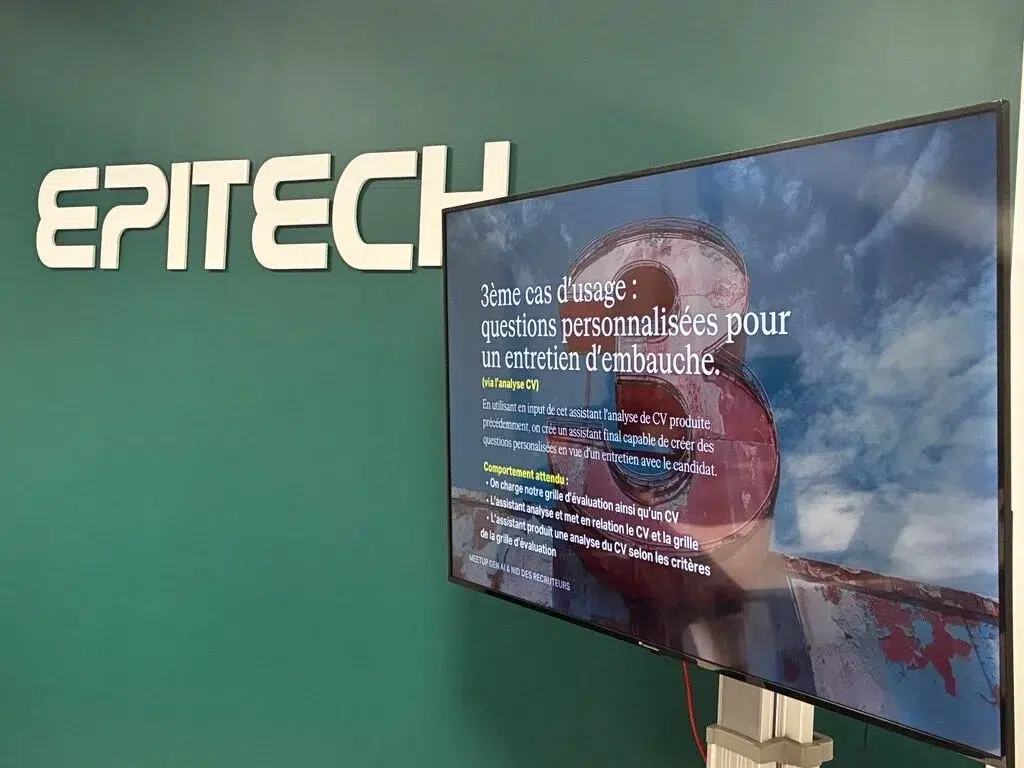 Un écran diffusant un diaporama sur l'usage de l'IA dans les méthodes de recrutement